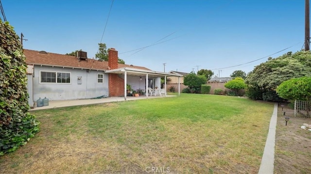 5007 Walnut Ave, Chino, CA 91710 - rear view of property with a fenced backyard, a patio area, and a chimney