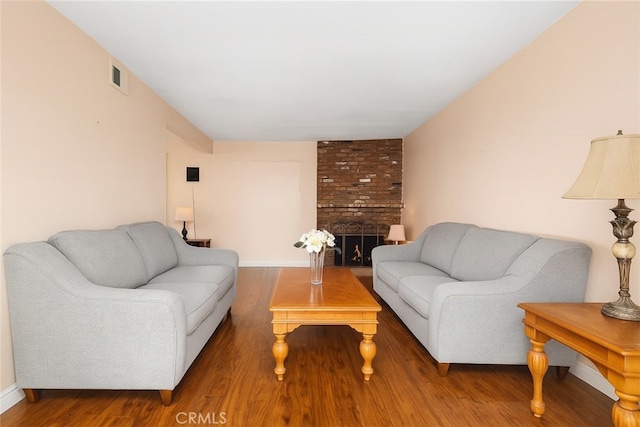 5007 Walnut Ave, Chino, CA 91710 - living room featuring wood finished floors and a fireplace