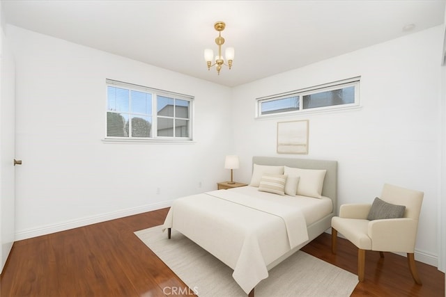 5007 Walnut Ave, Chino, CA 91710 - bedroom featuring a chandelier, multiple windows, and wood finished floors