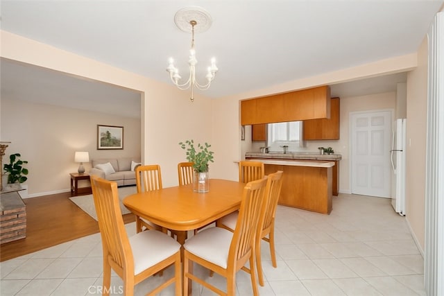 5007 Walnut Ave, Chino, CA 91710 - dining room with a chandelier and light tile patterned floors