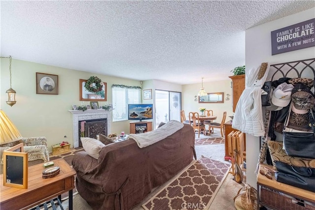 1363 San Simeon Ct Unit 7, Ventura, CA 93003 - living room with a textured ceiling, dark colored carpet, and a brick fireplace