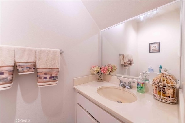 1363 San Simeon Ct Unit 7, Ventura, CA 93003 - bathroom featuring vanity and vaulted ceiling