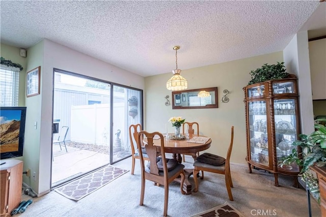 1363 San Simeon Ct Unit 7, Ventura, CA 93003 - dining room with light colored carpet and a textured ceiling