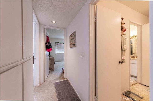 1363 San Simeon Ct Unit 7, Ventura, CA 93003 - hallway with a textured ceiling, recessed lighting, and light carpet
