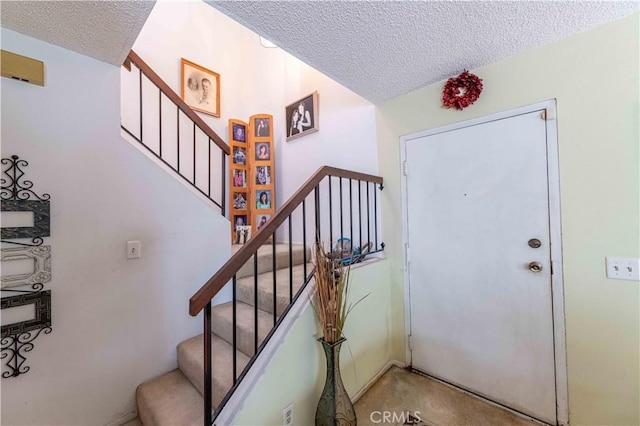 1363 San Simeon Ct Unit 7, Ventura, CA 93003 - carpeted entryway featuring a textured ceiling and stairs