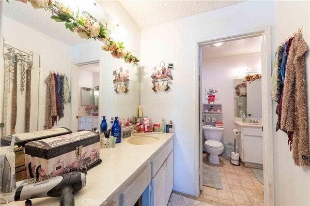 1363 San Simeon Ct Unit 7, Ventura, CA 93003 - bathroom with vanity and a textured ceiling