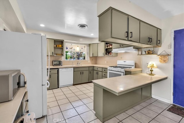 8160 Cholla Ave, Yucca Valley, CA 92284 - kitchen with white appliances, open shelves, under cabinet range hood, a peninsula, and recessed lighting