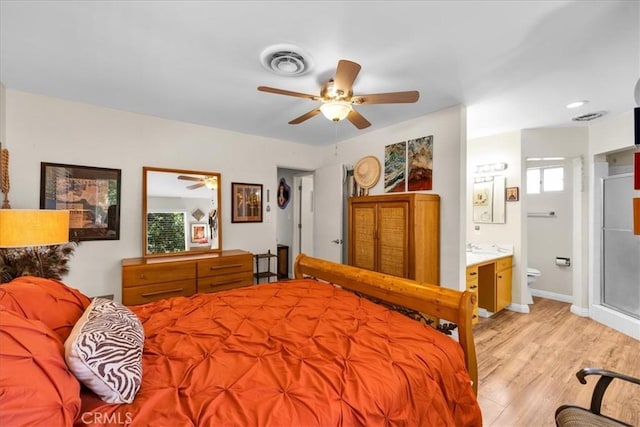 8160 Cholla Ave, Yucca Valley, CA 92284 - bedroom with light wood-style floors, connected bathroom, and ceiling fan