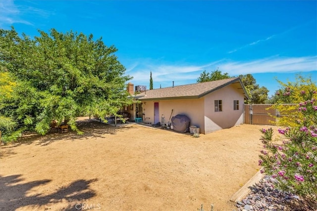 8160 Cholla Ave, Yucca Valley, CA 92284 - rear view of house featuring stucco siding