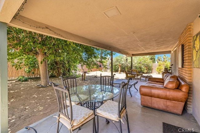 8160 Cholla Ave, Yucca Valley, CA 92284 - view of patio with outdoor dining area and outdoor lounge area