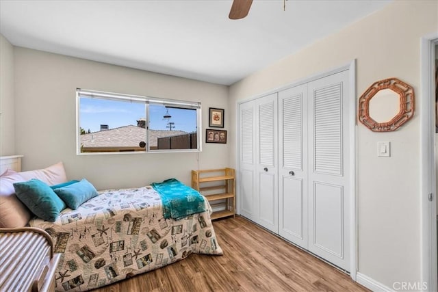 8160 Cholla Ave, Yucca Valley, CA 92284 - bedroom featuring light wood-style floors, a closet, and ceiling fan