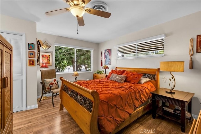 8160 Cholla Ave, Yucca Valley, CA 92284 - bedroom with wood finished floors and ceiling fan