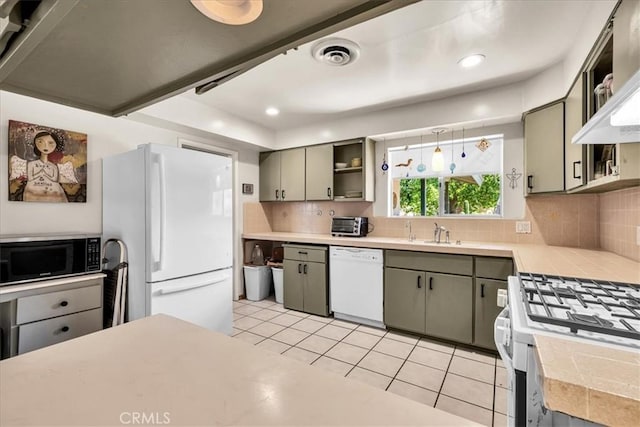 8160 Cholla Ave, Yucca Valley, CA 92284 - kitchen with white appliances, open shelves, decorative backsplash, light tile patterned floors, and recessed lighting