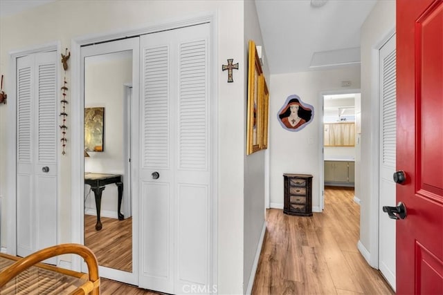 8160 Cholla Ave, Yucca Valley, CA 92284 - hallway featuring light wood-style flooring and baseboards