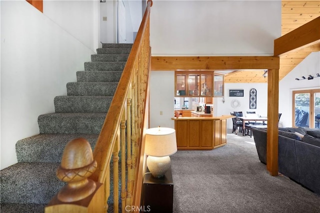77 Park Dr, Running Springs, CA 92382 - stairway featuring carpet and wood walls