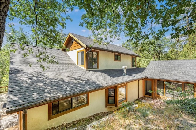 77 Park Dr, Running Springs, CA 92382 - rear view of property with stucco siding and roof with shingles