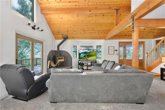77 Park Dr, Running Springs, CA 92382 - living room featuring wood ceiling, a wood stove, carpet, stairway, and high vaulted ceiling