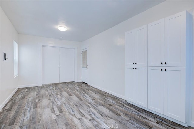 121/2 25th Pl Unit 2, Venice, CA 90291 - unfurnished bedroom with wood finished floors and baseboards