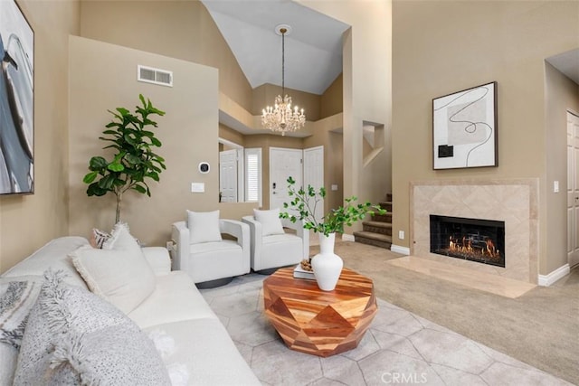 25066 El Carrizo, Laguna Niguel, CA 92677 - living area with carpet, a chandelier, stairs, high vaulted ceiling, and a fireplace