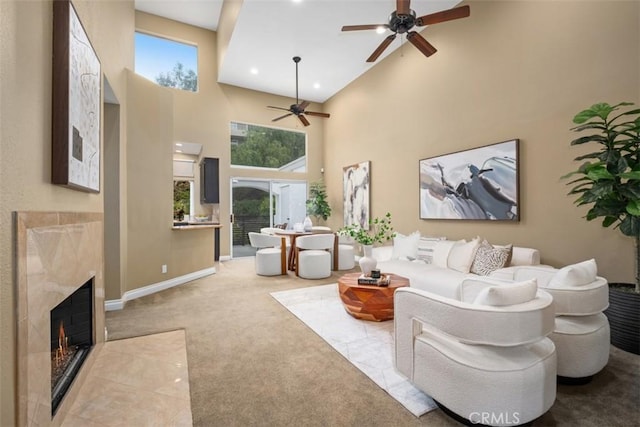 25066 El Carrizo, Laguna Niguel, CA 92677 - living area featuring a ceiling fan, a high ceiling, a fireplace, and carpet flooring