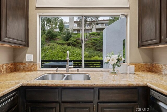 25066 El Carrizo, Laguna Niguel, CA 92677 - kitchen featuring dark brown cabinets, dishwasher, and light stone countertops