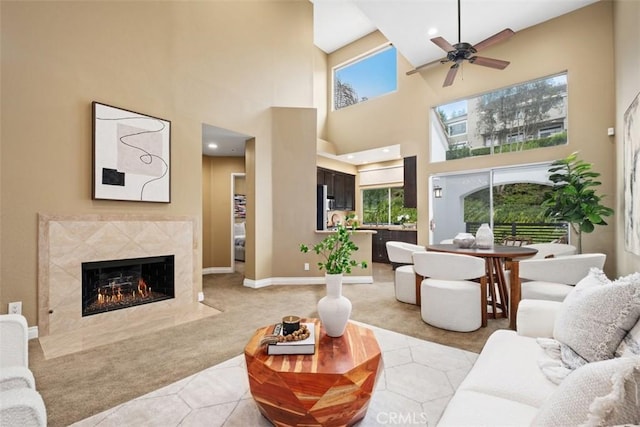 25066 El Carrizo, Laguna Niguel, CA 92677 - living room featuring light carpet, a premium fireplace, ceiling fan, a high ceiling, and recessed lighting