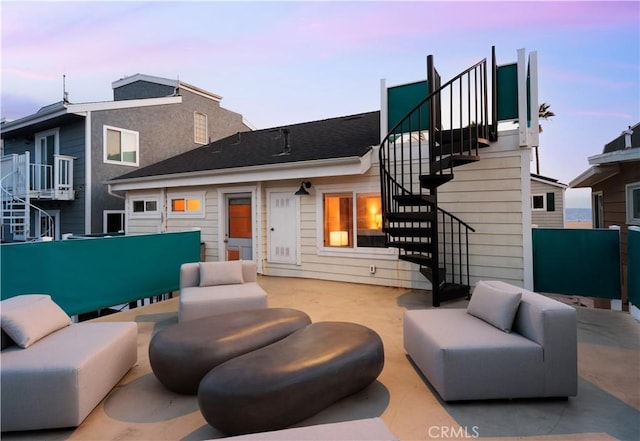 29 Surfside Ave Unit B, Surfside, CA 90743 - rear view of property featuring stairs, an outdoor living space, and a patio area