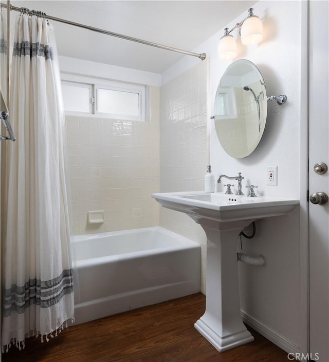 29 Surfside Ave Unit B, Surfside, CA 90743 - bathroom featuring shower / bath combination with curtain and wood finished floors
