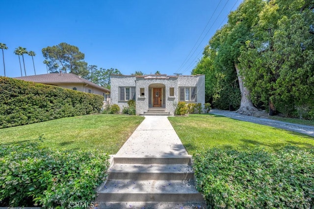 315 E Randolph St, Glendale, CA 91207 - view of front of home with a front yard and stone siding
