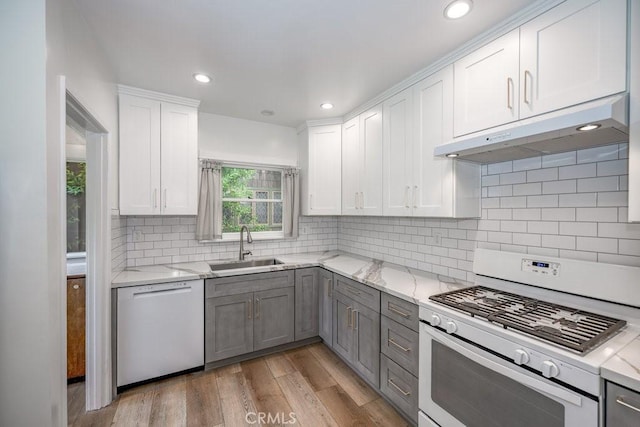 315 E Randolph St, Glendale, CA 91207 - kitchen with dishwasher, white range with gas stovetop, under cabinet range hood, gray cabinets, and white cabinetry