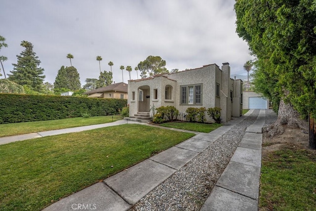 315 E Randolph St, Glendale, CA 91207 - mediterranean / spanish-style home with stucco siding, concrete driveway, a front lawn, a garage, and an outdoor structure
