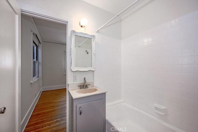315 E Randolph St, Glendale, CA 91207 - full bathroom with vanity, washtub / shower combination, and wood finished floors