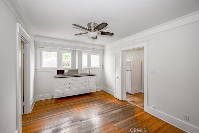 315 E Randolph St, Glendale, CA 91207 - unfurnished bedroom with freestanding refrigerator, ornamental molding, wood finished floors, and a ceiling fan