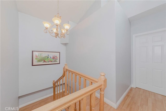 215 N Maple Ave Unit A, Montebello, CA 90640 - staircase featuring a chandelier, wood finished floors, and lofted ceiling