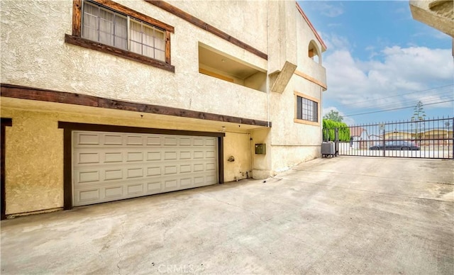 215 N Maple Ave Unit A, Montebello, CA 90640 - garage with concrete driveway and a gate