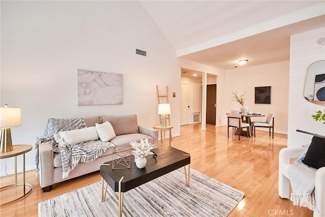 4280 Via Arbolada Unit 338, Los Angeles, CA 90042 - living room featuring light wood-style flooring and high vaulted ceiling