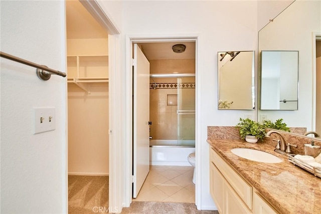 4280 Via Arbolada Unit 338, Los Angeles, CA 90042 - bathroom featuring vanity, tub / shower combination, tile patterned floors, and a walk in closet