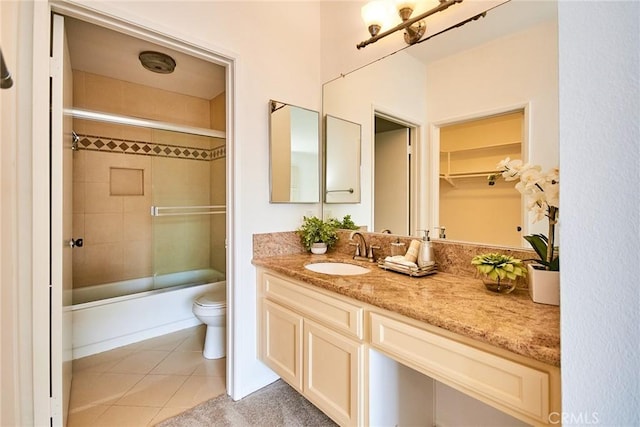 4280 Via Arbolada Unit 338, Los Angeles, CA 90042 - full bathroom featuring vanity, tile patterned floors, and bath / shower combo with glass door