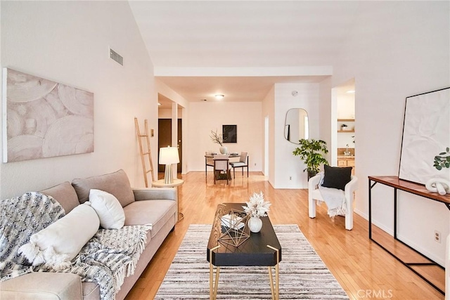 4280 Via Arbolada Unit 338, Los Angeles, CA 90042 - living room with light wood finished floors and vaulted ceiling