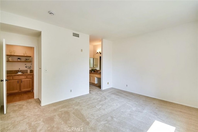 4280 Via Arbolada Unit 338, Los Angeles, CA 90042 - unfurnished bedroom with light colored carpet and connected bathroom