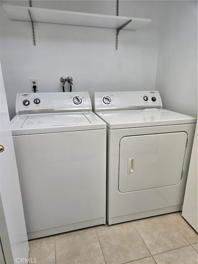 4280 Via Arbolada Unit 338, Los Angeles, CA 90042 - laundry room featuring washing machine and clothes dryer and light tile patterned floors