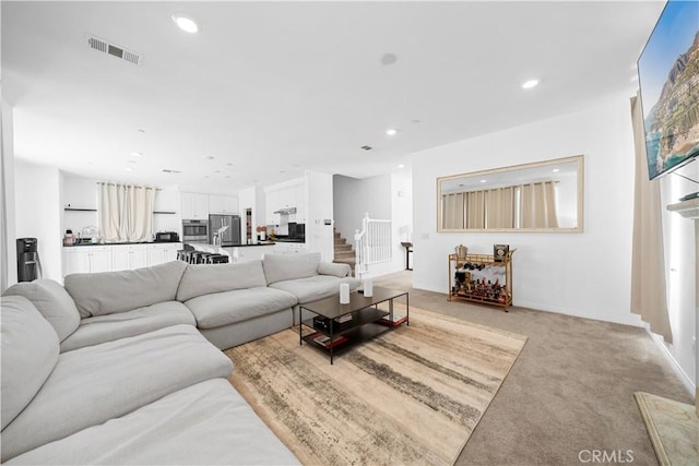 13126 Flagstaff Dr, Rancho Cucamonga, CA 91739 - living room featuring light carpet, stairs, and recessed lighting