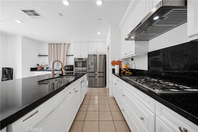13126 Flagstaff Dr, Rancho Cucamonga, CA 91739 - kitchen with appliances with stainless steel finishes, extractor fan, white cabinets, and recessed lighting