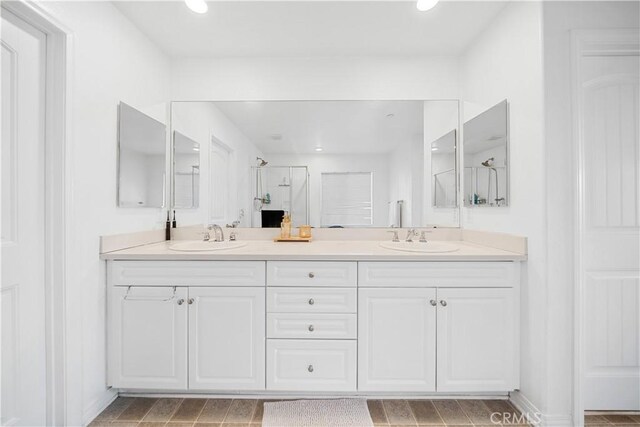 13126 Flagstaff Dr, Rancho Cucamonga, CA 91739 - full bathroom with double vanity, a stall shower, and recessed lighting