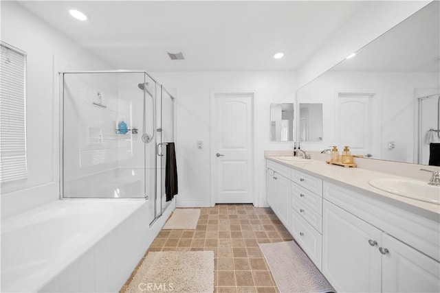 13126 Flagstaff Dr, Rancho Cucamonga, CA 91739 - full bath with a stall shower, double vanity, a garden tub, and recessed lighting