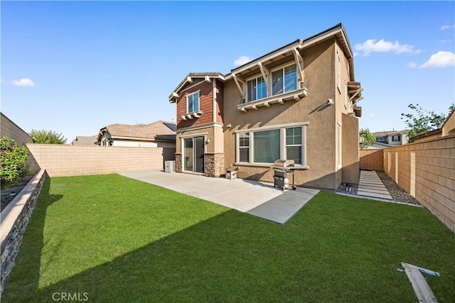 13126 Flagstaff Dr, Rancho Cucamonga, CA 91739 - back of house featuring stucco siding, a fenced backyard, a patio, and stone siding