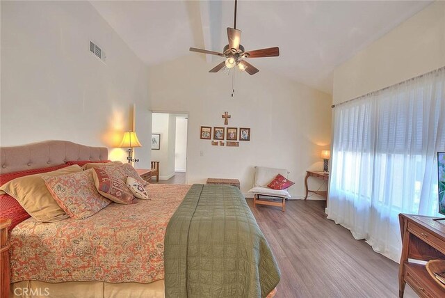 1531 Corte Caballo Unit 33, Upland, CA 91786 - bedroom with wood finished floors, high vaulted ceiling, and ceiling fan
