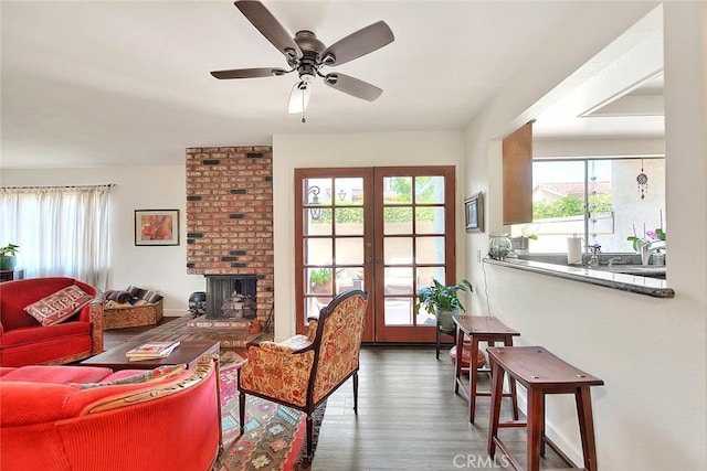 1531 Corte Caballo Unit 33, Upland, CA 91786 - living area with healthy amount of natural light, wood finished floors, french doors, and a ceiling fan