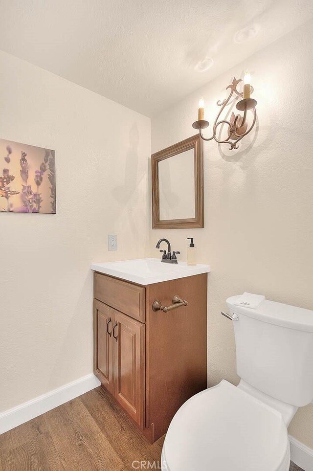 1531 Corte Caballo Unit 33, Upland, CA 91786 - half bathroom with vanity and wood finished floors