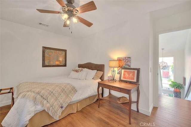 1531 Corte Caballo Unit 33, Upland, CA 91786 - bedroom featuring wood finished floors and ceiling fan